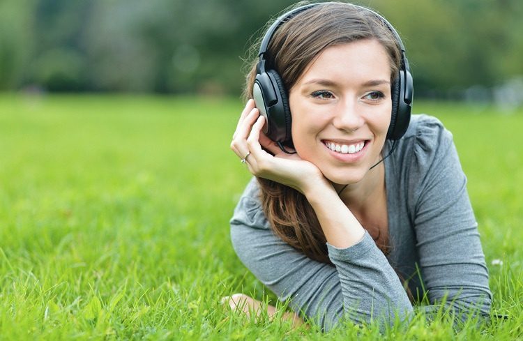 girl with earphones in nature