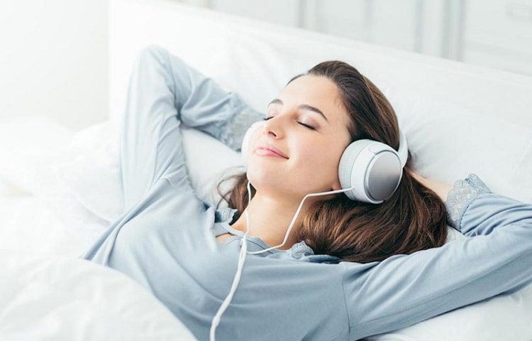 girl sleeping with headphones