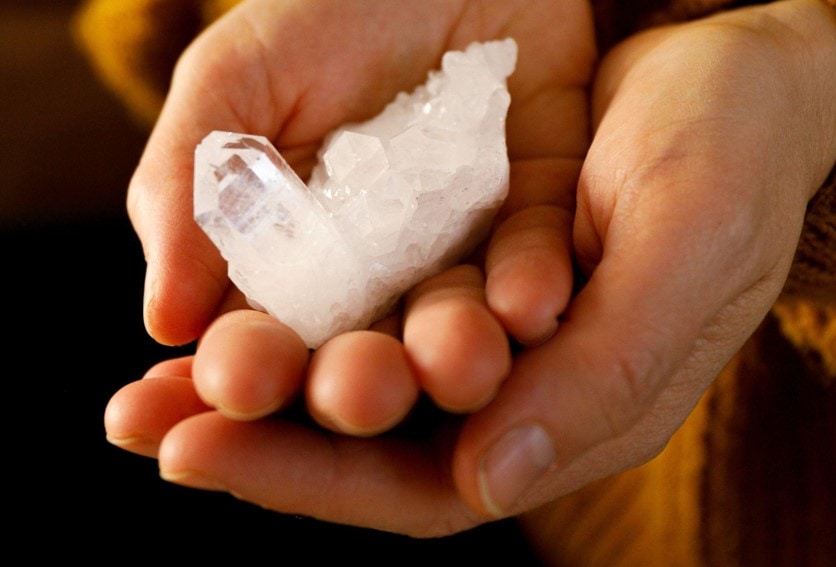 person holding a crystal