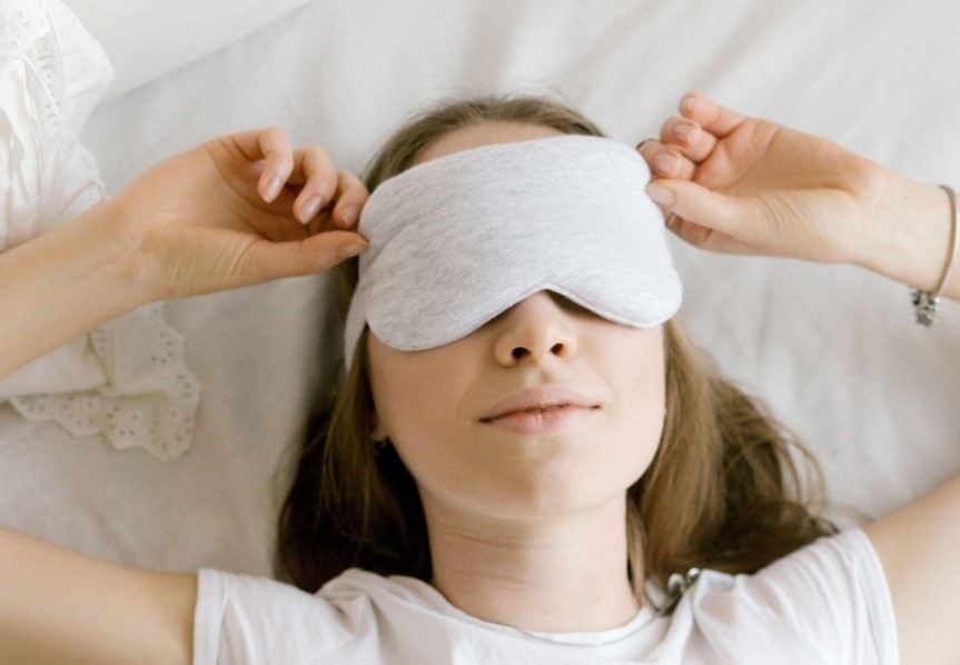 woman wearing a sleeping mask