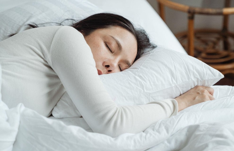 women sleeping on a pillow