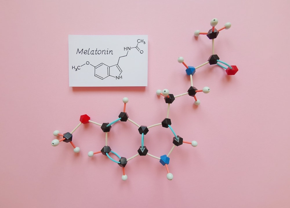 molecular structure model and structural chemical formula of melatonin molecule