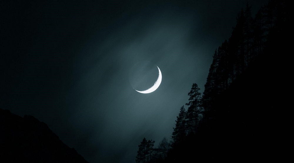 A moon in the night sky