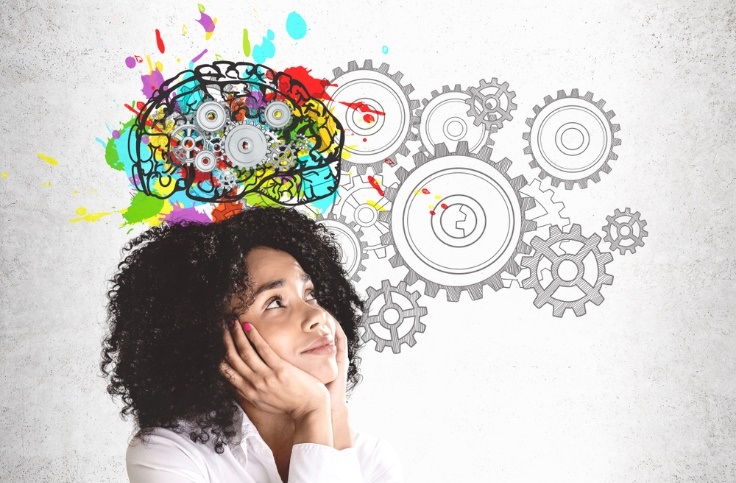 Smiling woman with colorful brain sketch with gears